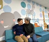 Eamon laughs with his mother