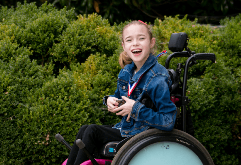 Madison Rogers, a young girl using a motorized wheelchair